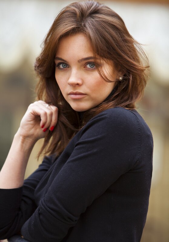 woman with brown hair and blue eyes