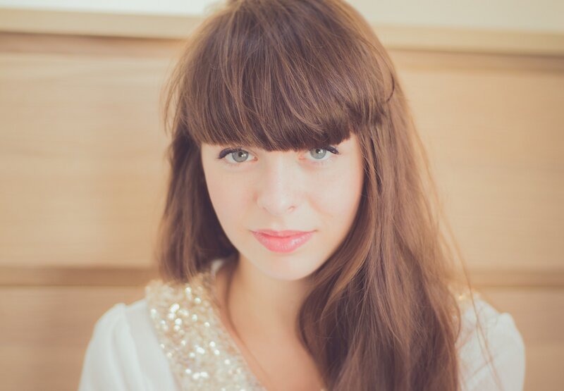 woman with brown hair and blue eyes