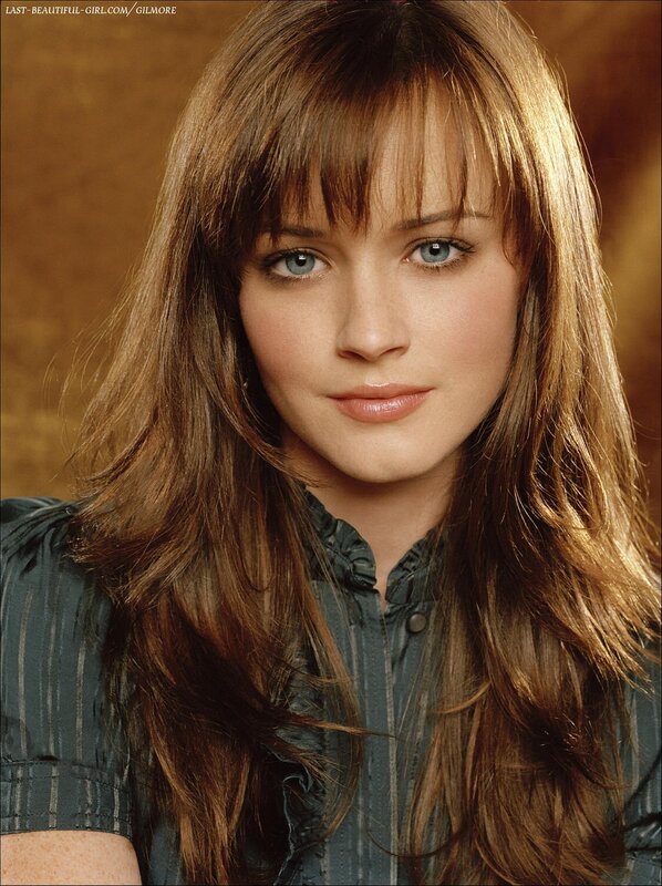 woman with brown hair and blue eyes