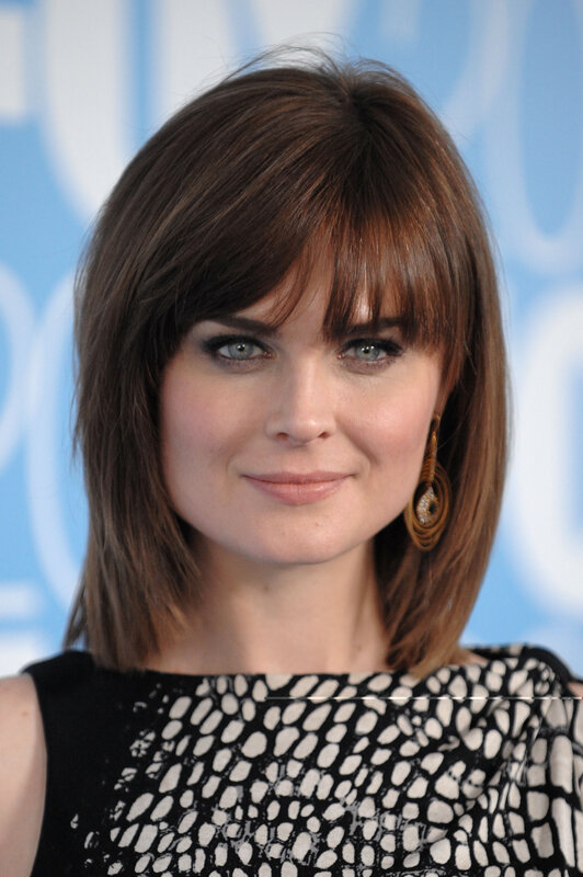 woman with brown hair and blue eyes