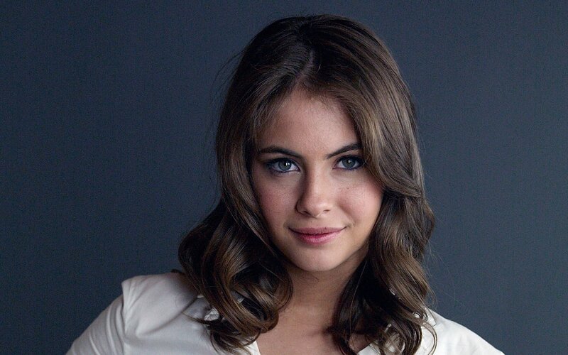woman with brown hair and blue eyes