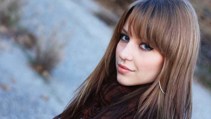 woman with brown hair and blue eyes