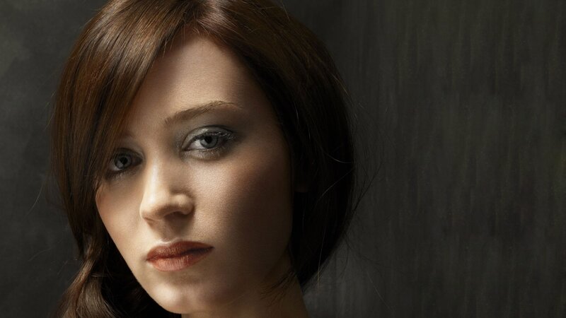 woman with brown hair and blue eyes