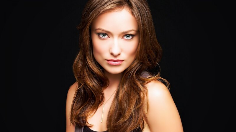 woman with brown hair and blue eyes