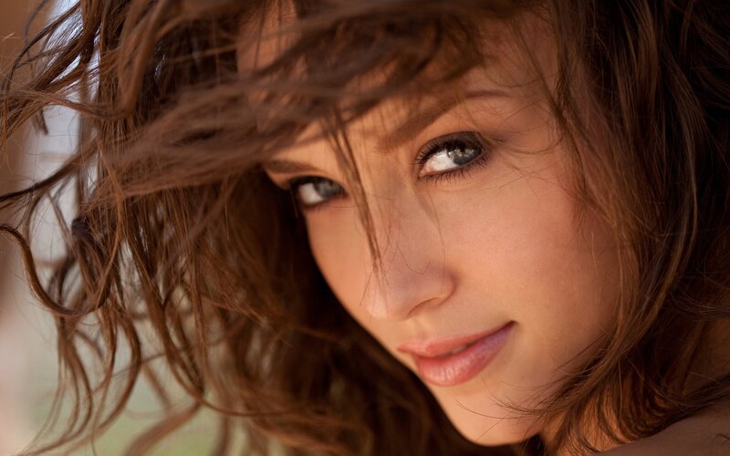 woman with brown hair and blue eyes