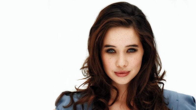 woman with brown hair and blue eyes