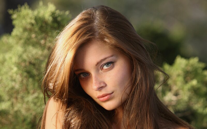 woman with brown hair and blue eyes