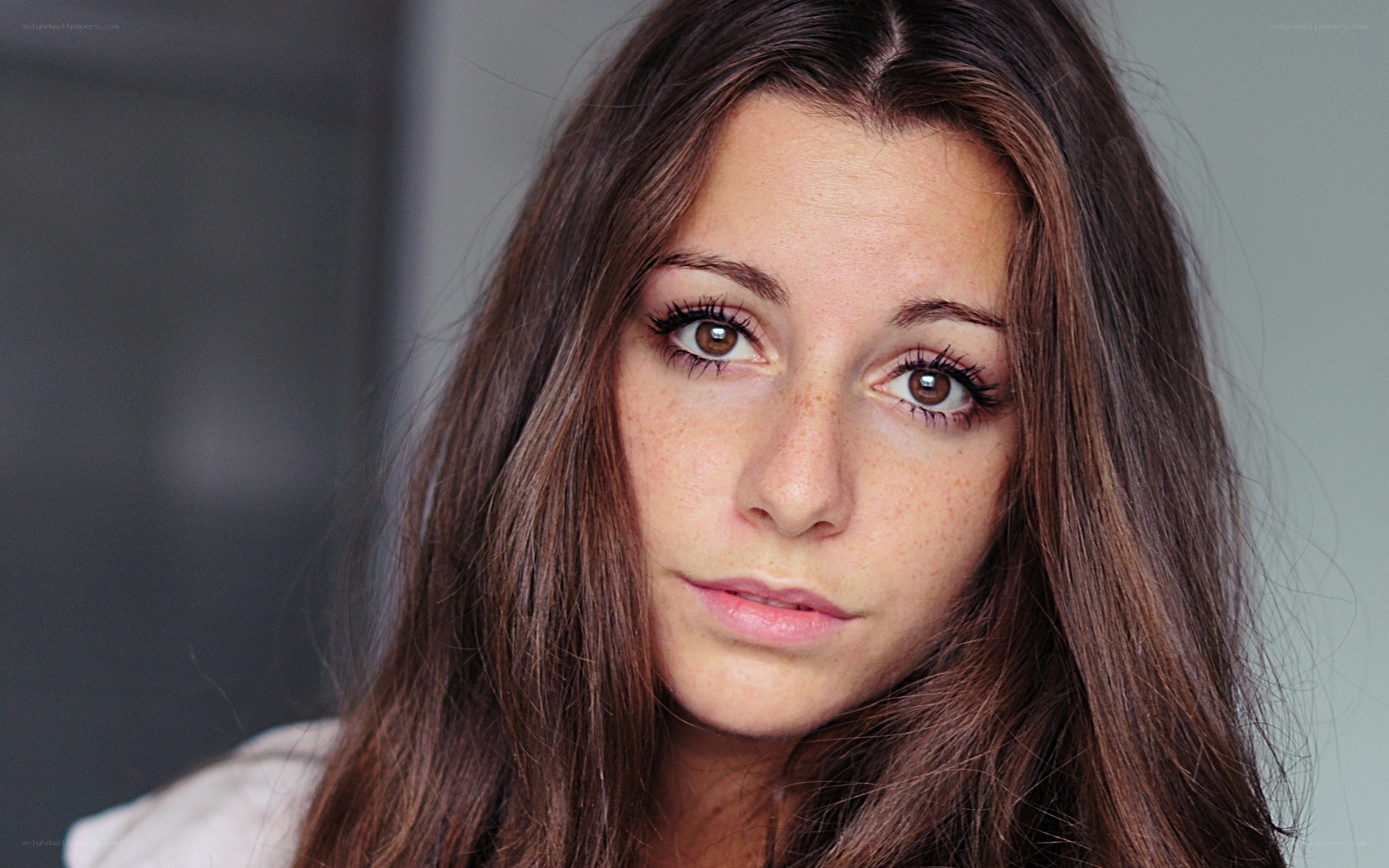 woman with brown hair and freckles