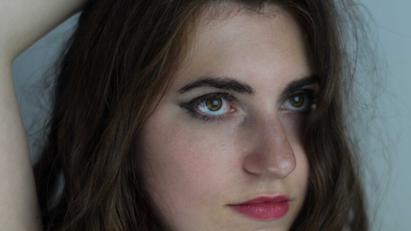 woman with brown hair and green eyes