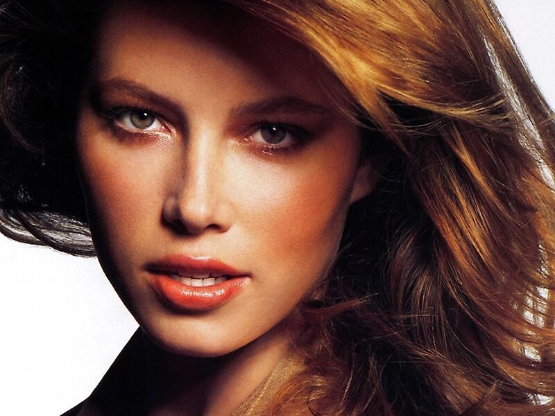 woman with brown hair and green eyes