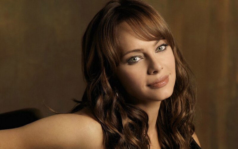 woman with brown hair and green eyes