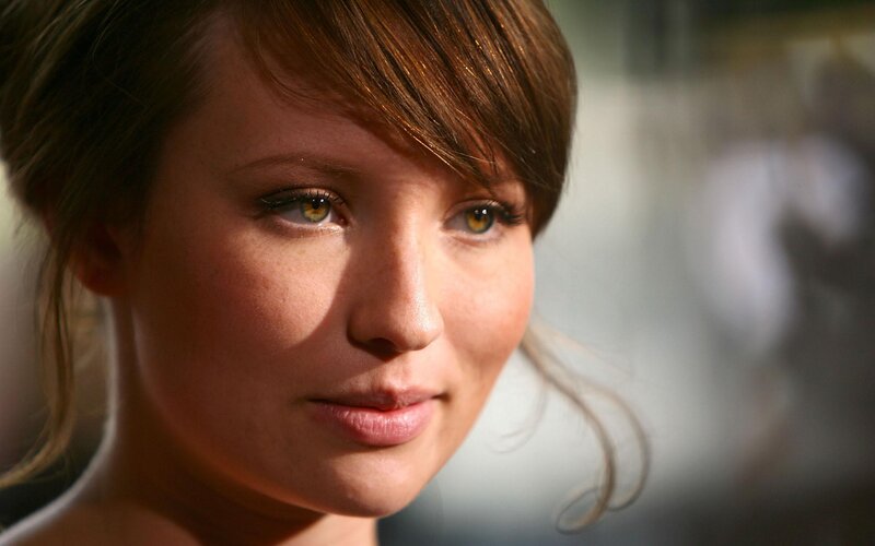 woman with brown hair and green eyes