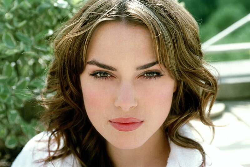 woman with brown hair and green eyes