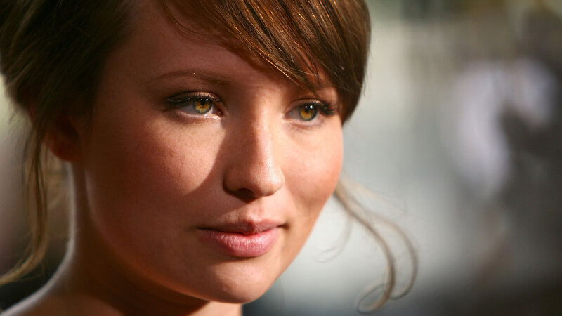 woman with brown hair and green eyes