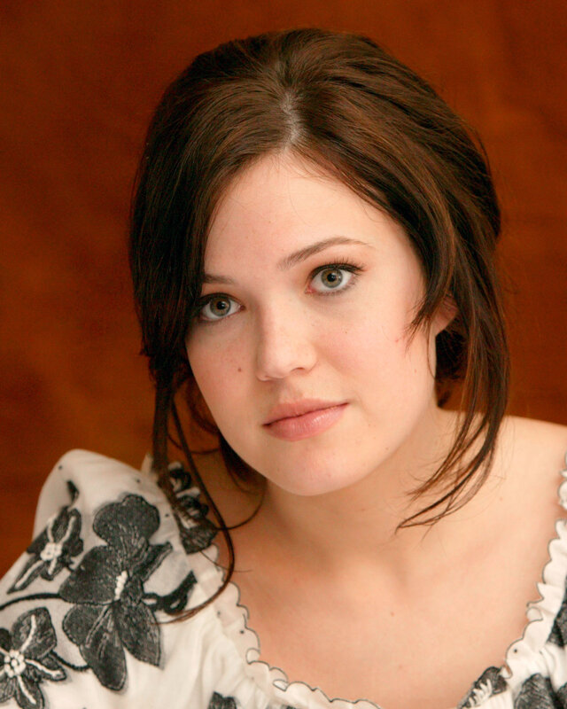 woman with brown hair and green eyes