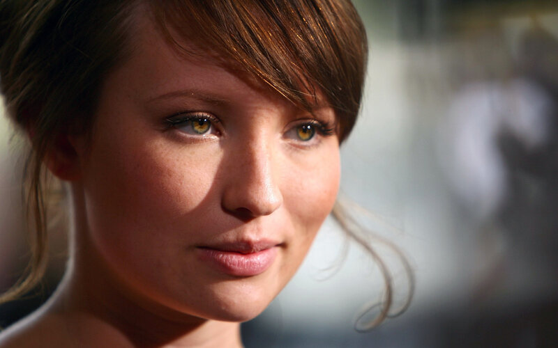 woman with brown hair and green eyes