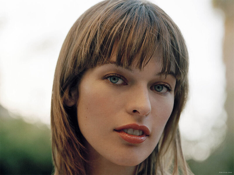 woman with brown hair and green eyes