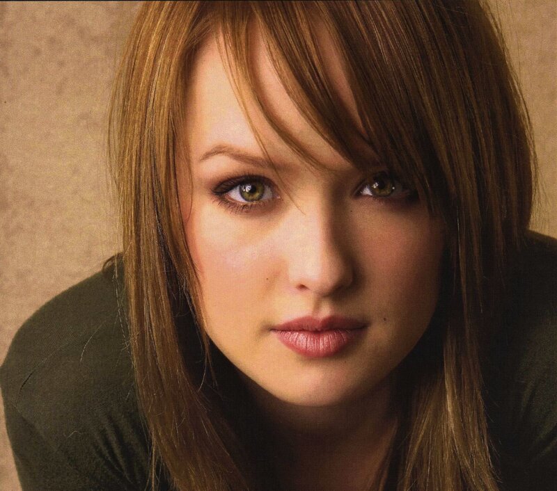 woman with brown hair and green eyes