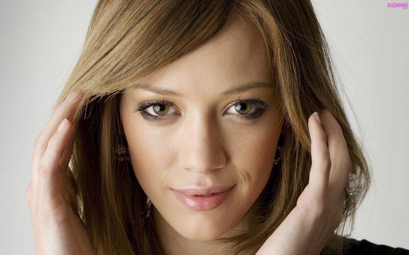 woman with brown hair and green eyes