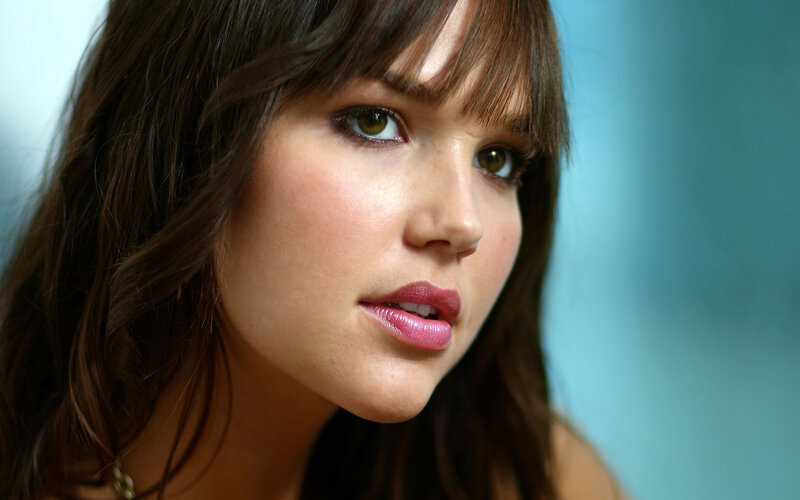 woman with brown hair and green eyes
