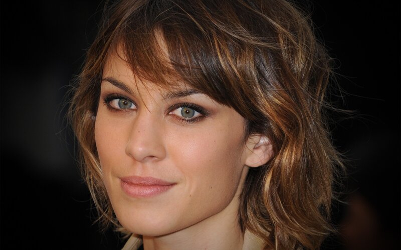 woman with brown hair and green eyes
