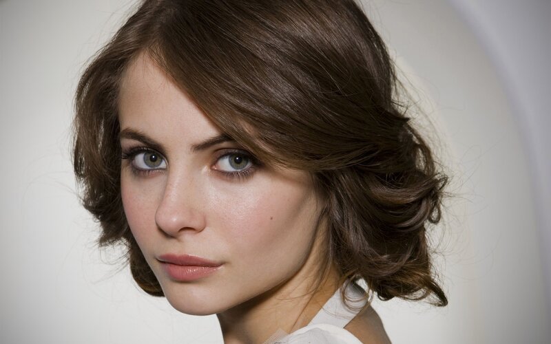 woman with brown hair and green eyes