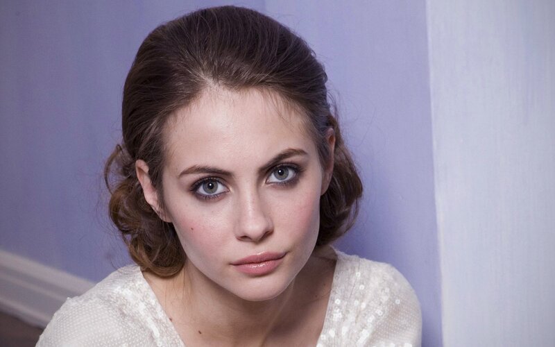 woman with brown hair and green eyes