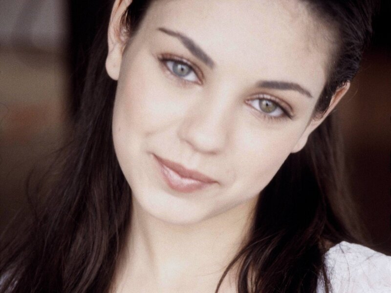 woman with brown hair and green eyes