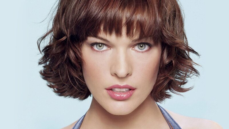 woman with brown hair and green eyes