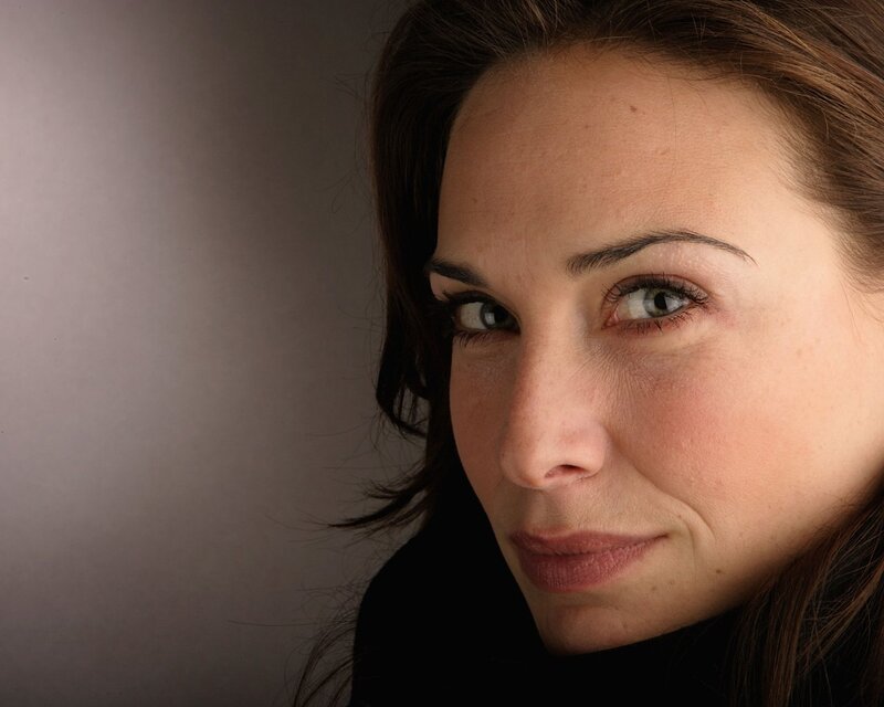 woman with brown hair and green eyes