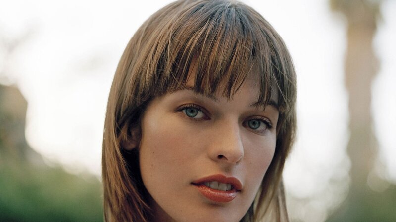 woman with brown hair and green eyes