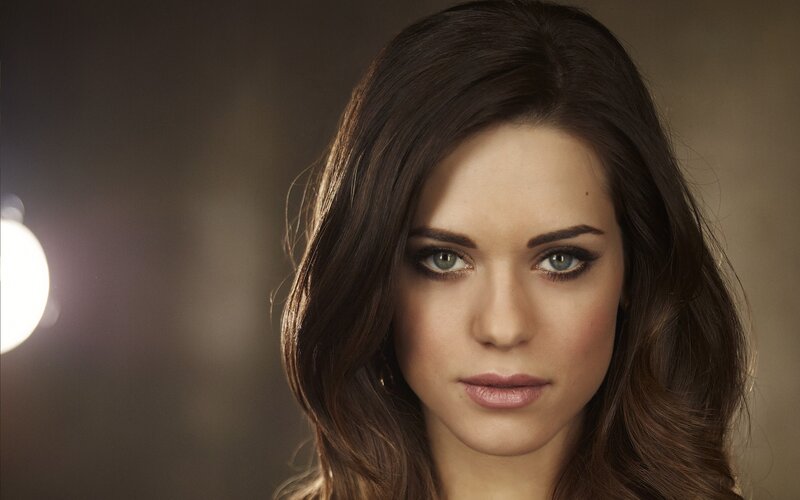 woman with brown hair and green eyes