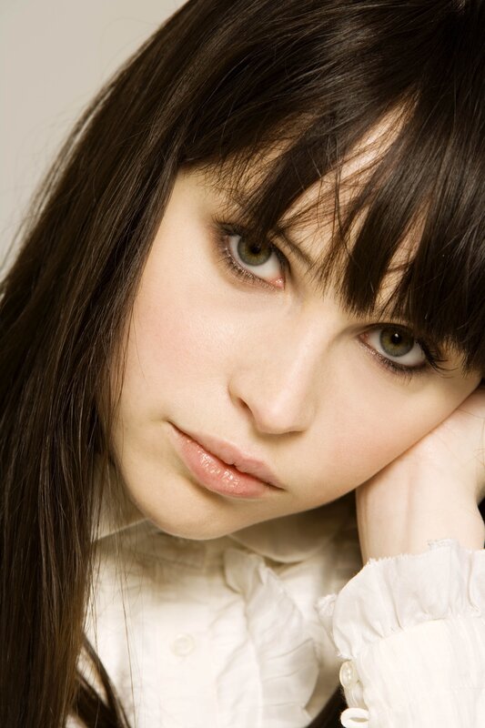 woman with brown hair and green eyes