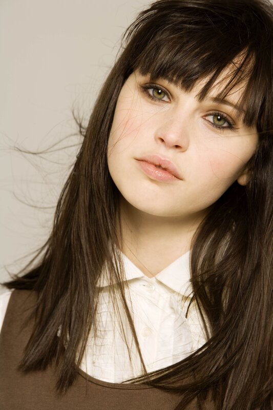 woman with brown hair and green eyes