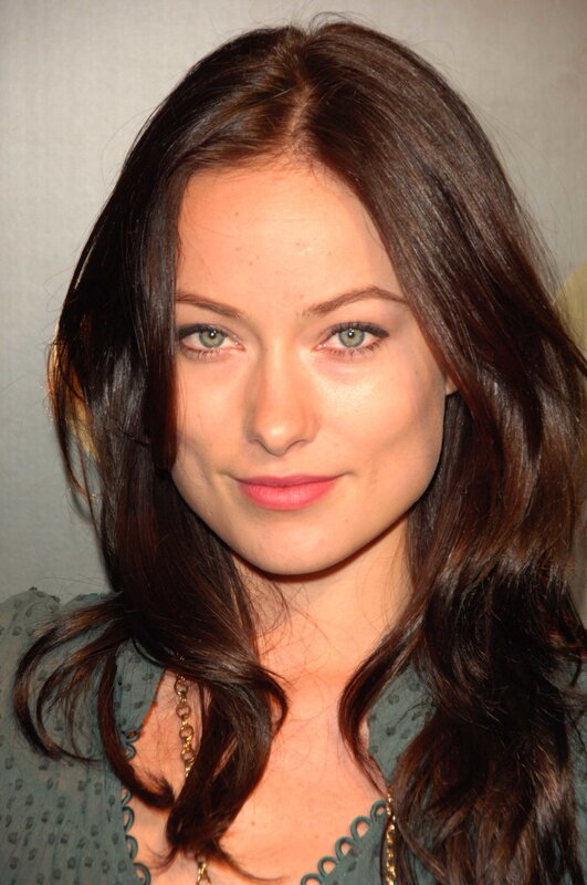 woman with brown hair and green eyes