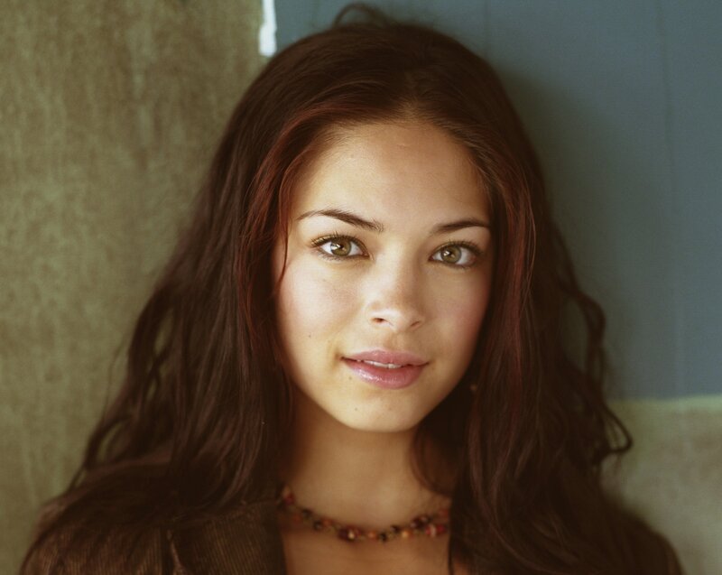 woman with brown hair and green eyes