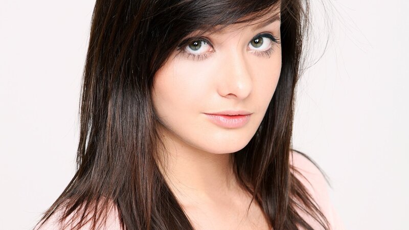 woman with brown hair and green eyes