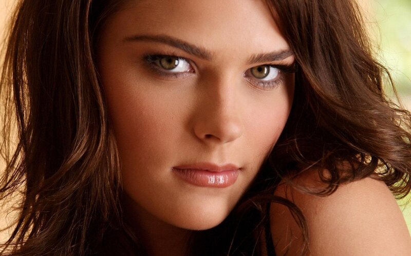 woman with brown hair and green eyes