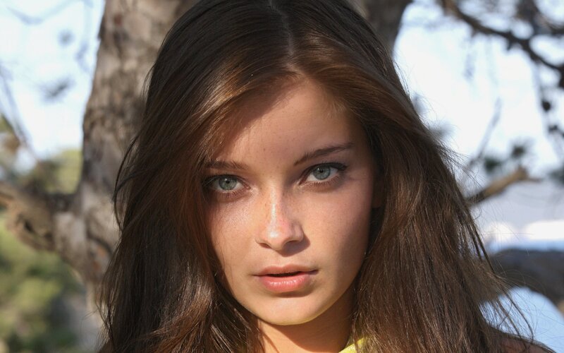 woman with brown hair and green eyes