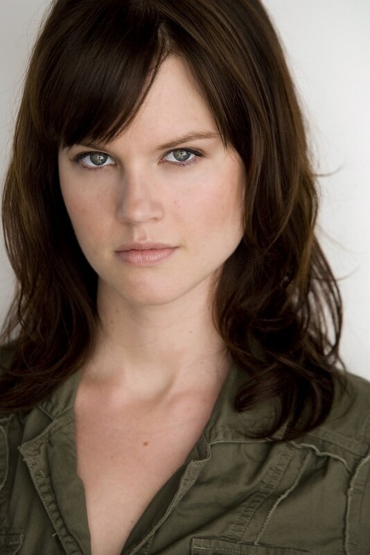 woman with brown hair and green eyes