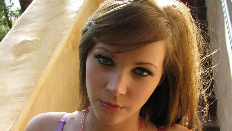 woman with brown hair and green eyes