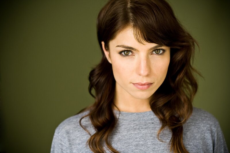 woman with brown hair and green eyes