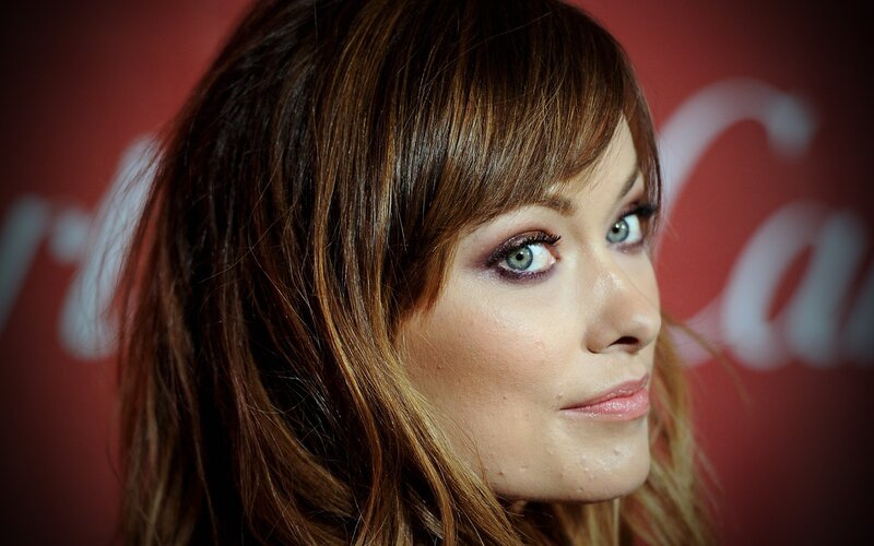 woman with brown hair and green eyes