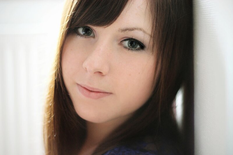 woman with brown hair and green eyes