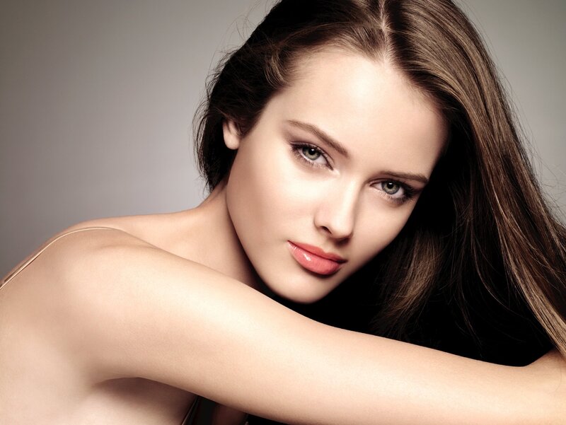 woman with brown hair and green eyes
