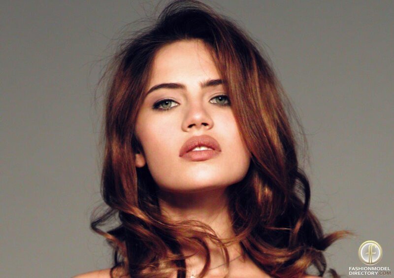 woman with brown hair and green eyes