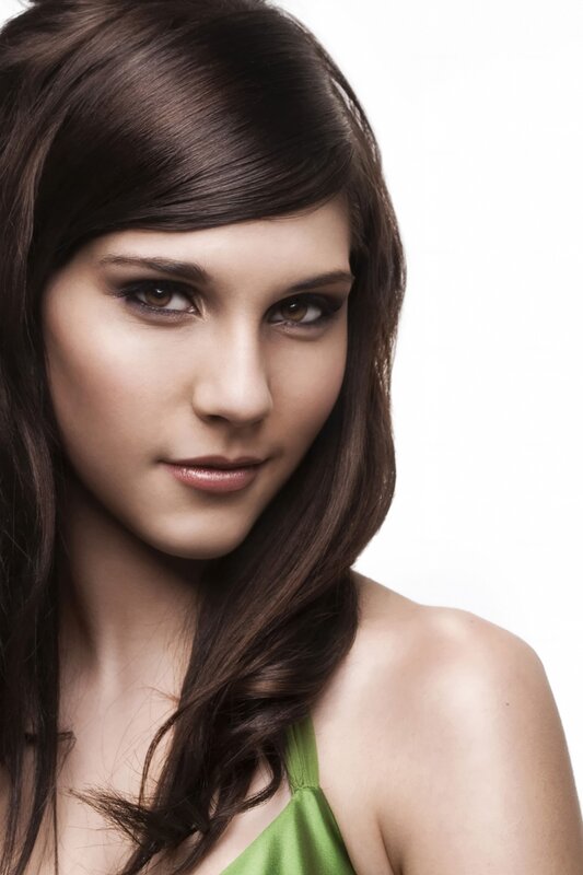 woman with brown hair and green top