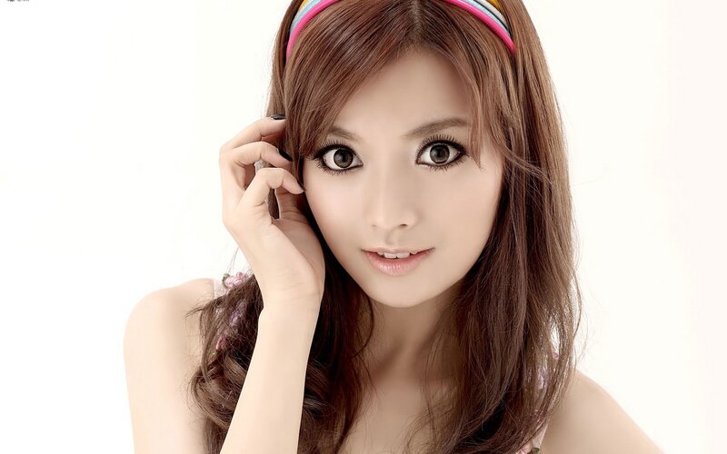 woman with brown hair and headband