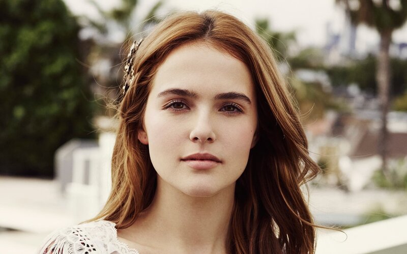 woman with brown hair and headband