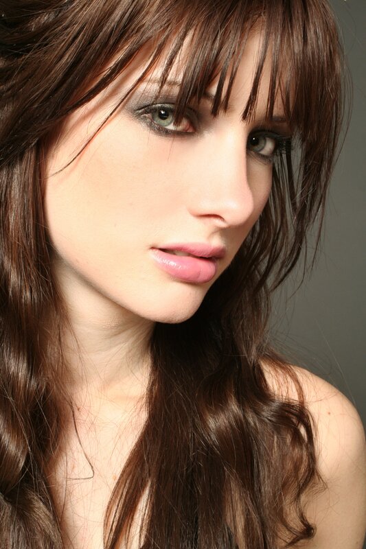 woman with brown hair and makeup
